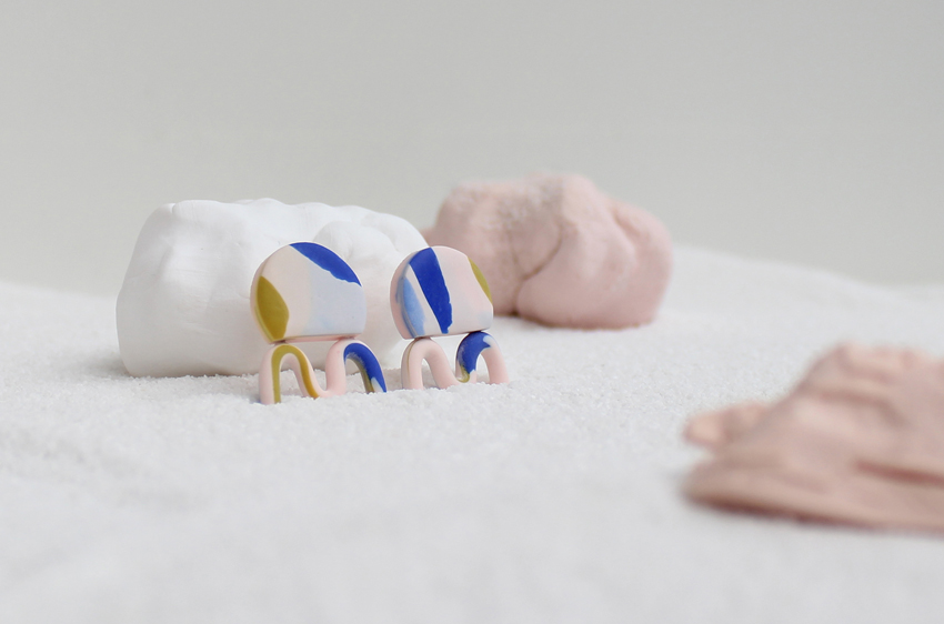 Kate Trouw Wiggle Earrings in pink with a blue and yellow terrazzo design