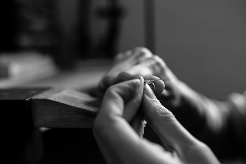 Jeweller Heather Woof at her work bench