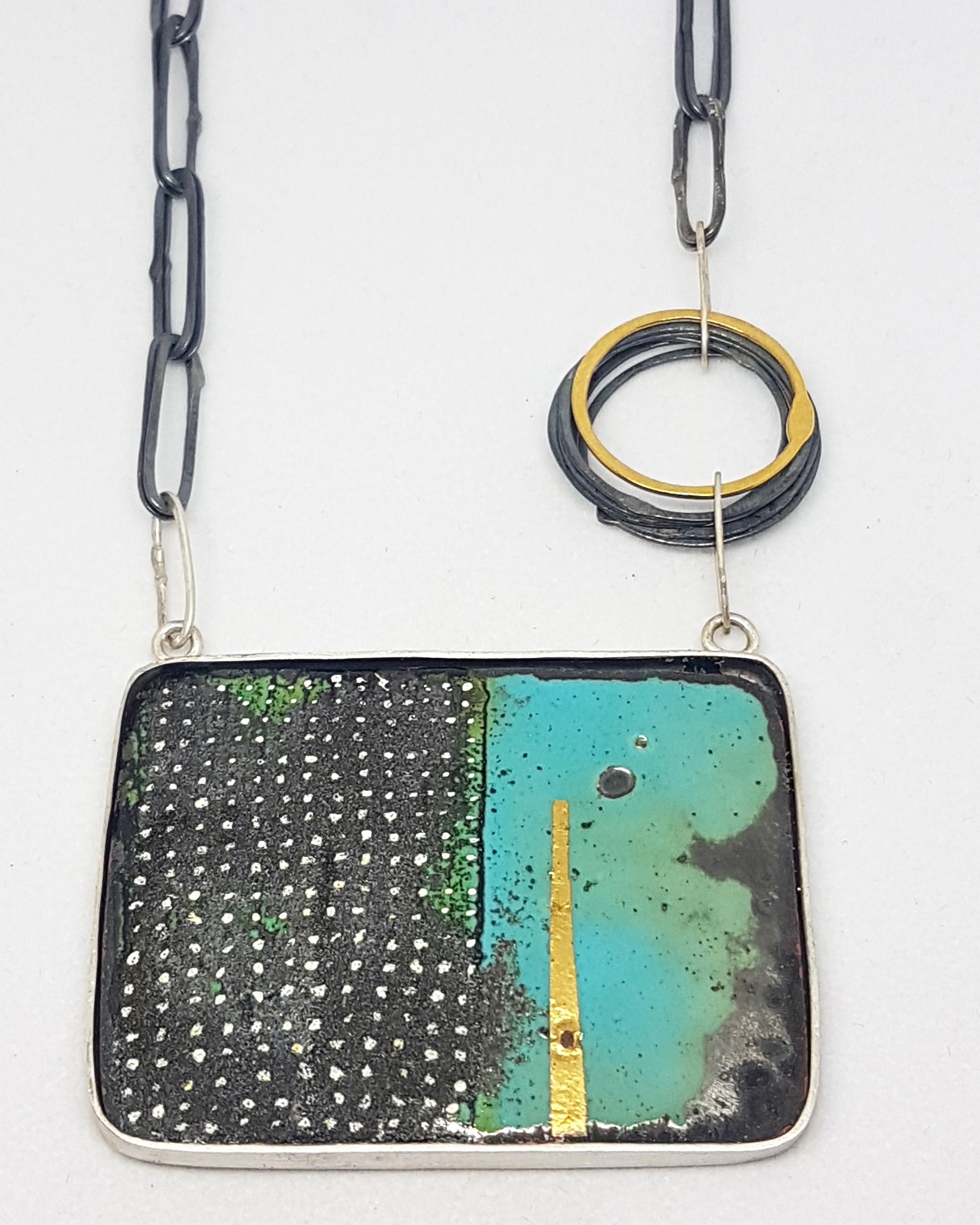 Teal and dotty enamel necklace.