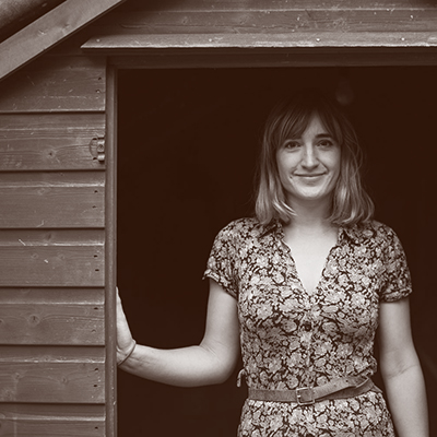 Agnes Jones, Blacksmith, Glasgow, stands in a shed. Part of COMPASS: Established Makers Round 2 