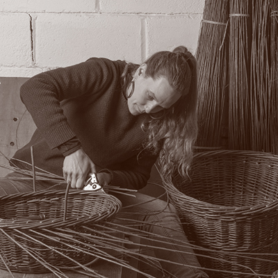 Anna Liebmann - Willow Weaving - Edinburgh. Anna is shown weaving a basket. Part of COMPASS: Established Makers Round 2 