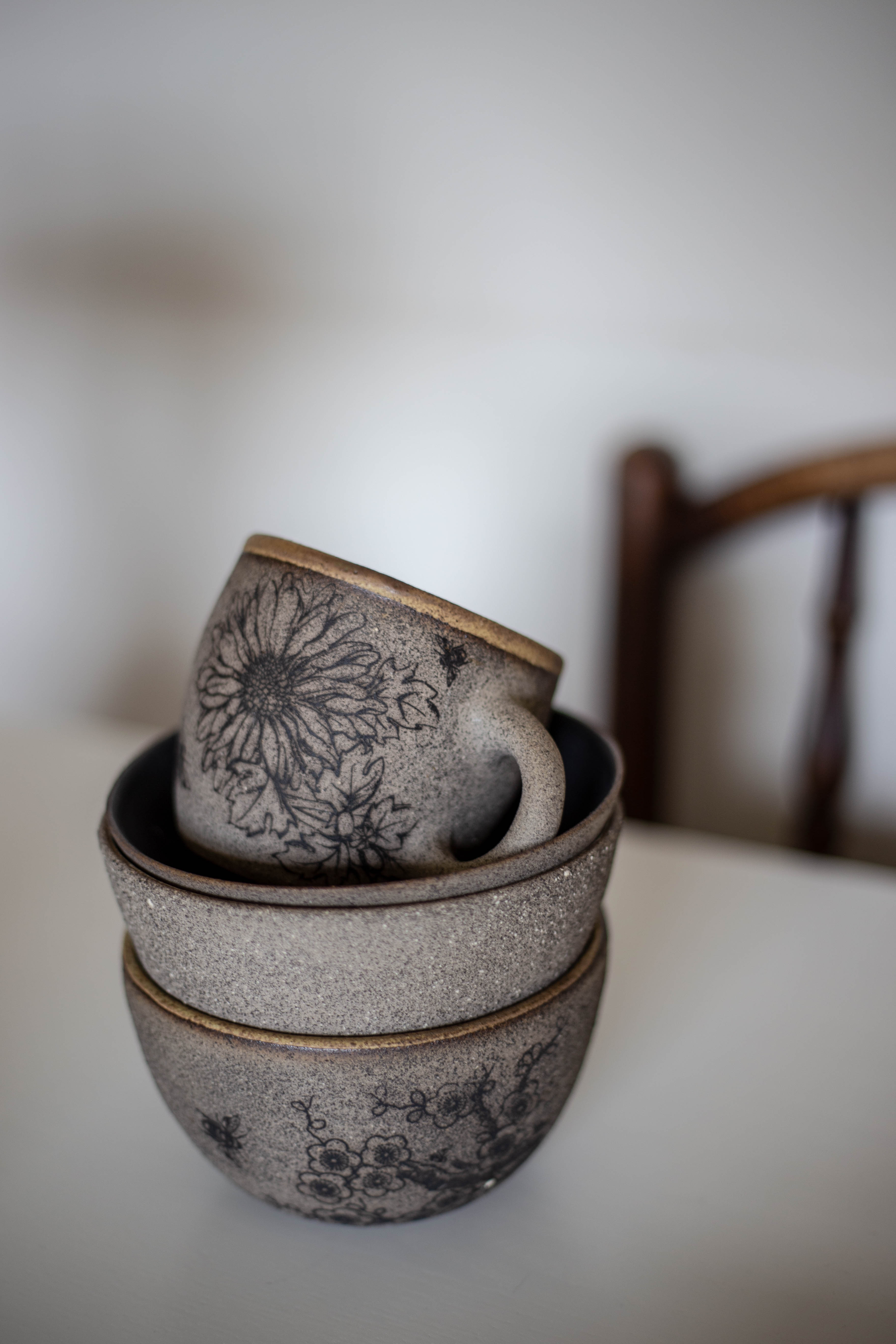 Grey stoneware with applied decals and various liner glazes/>
              </div>
              <div class=