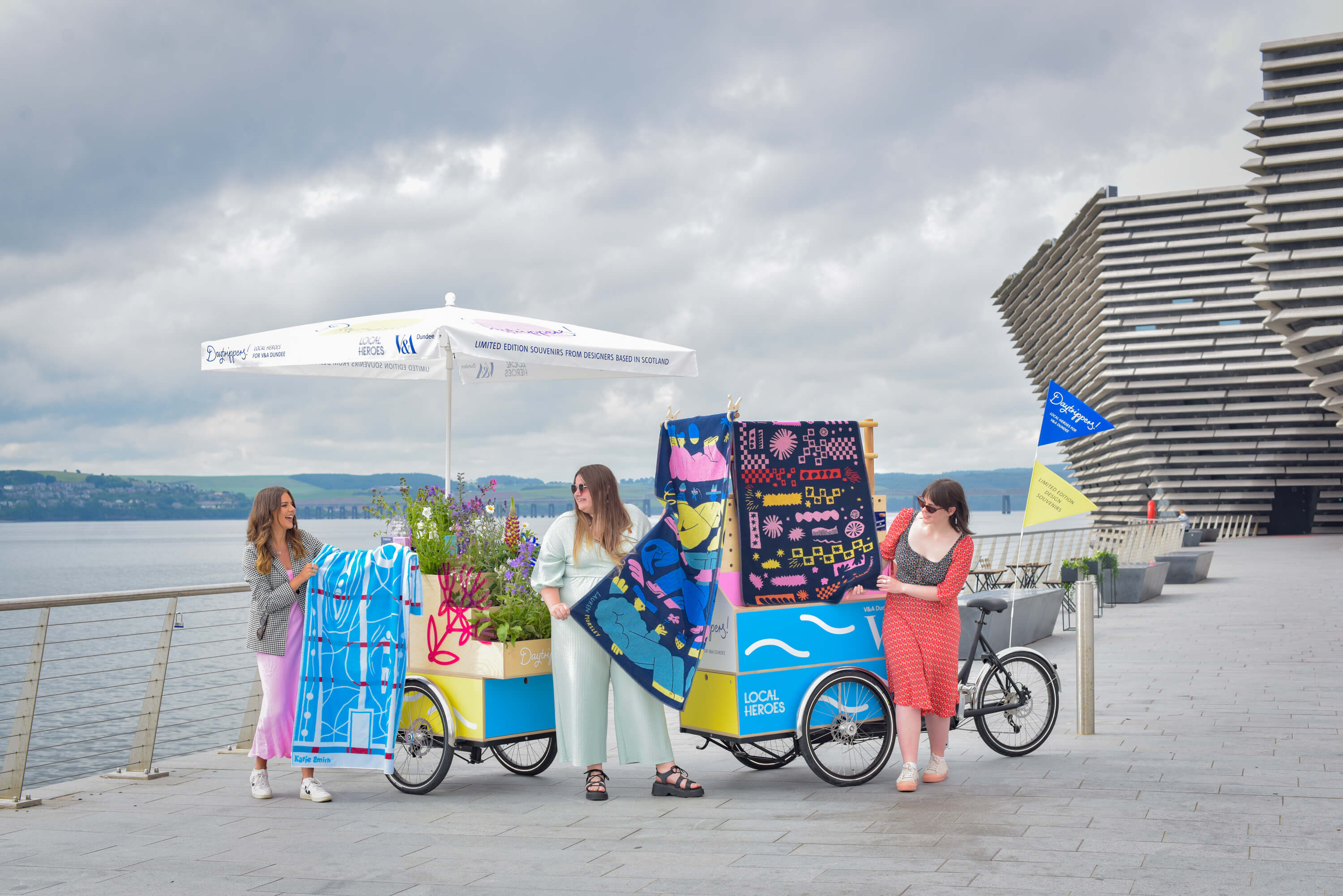 Local Heroes V&A Dundee - People stand in front of the river Tay with Daytrippers products