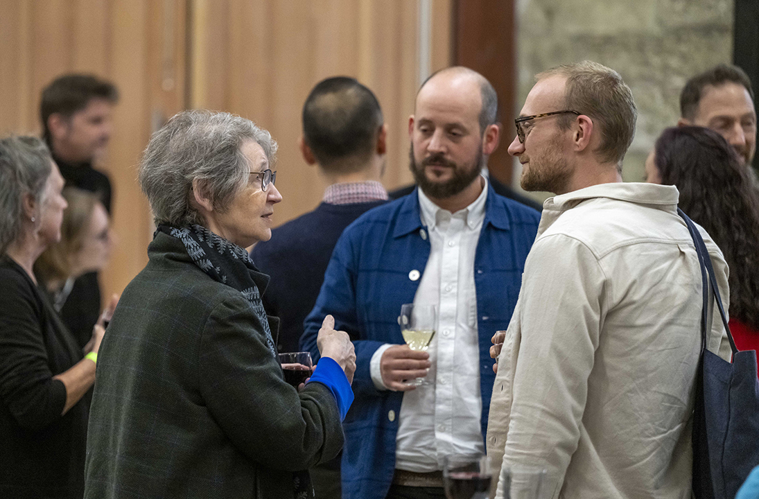 Delegates at a social event following The Power of Glass Symposium