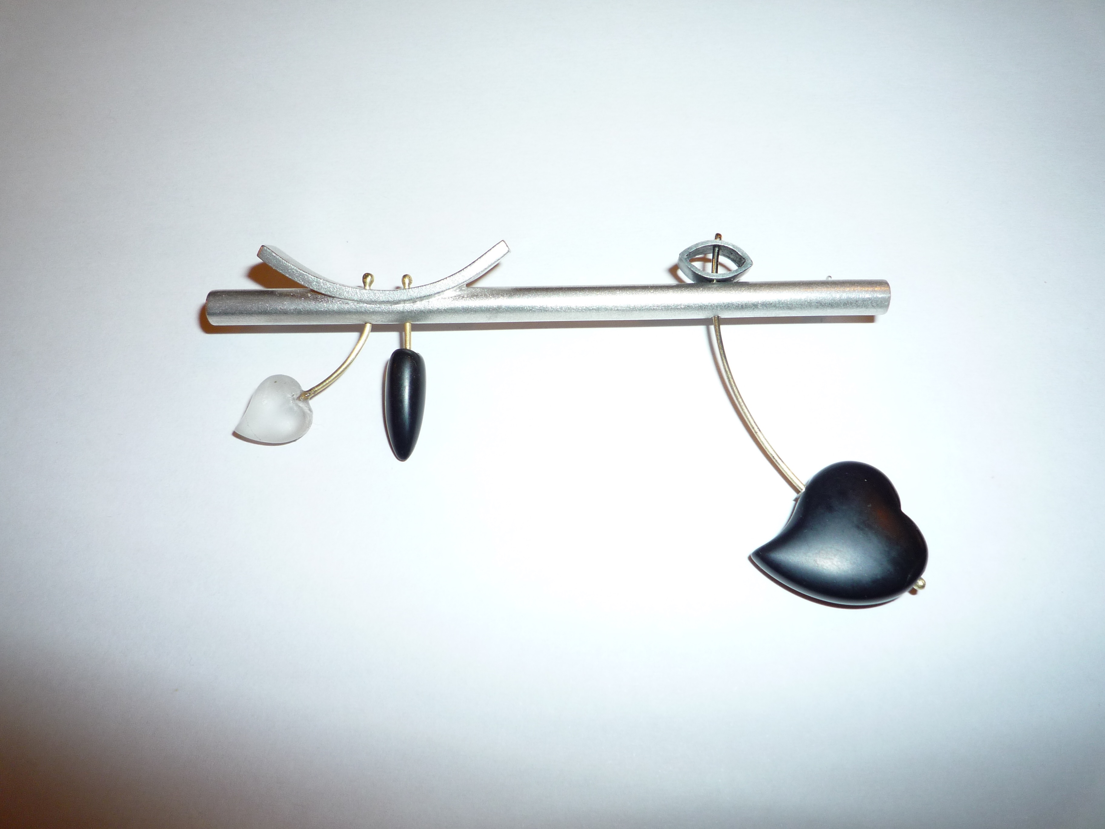 Silver 18ct gold and black onyx heart brooch	