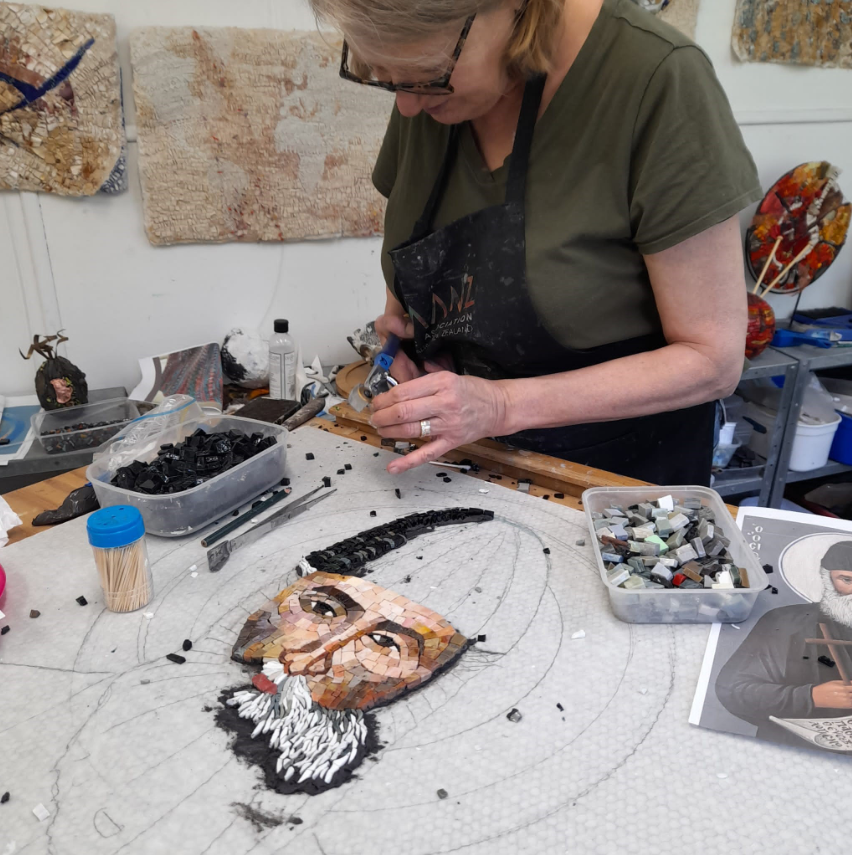 woman creating a mosaic image
