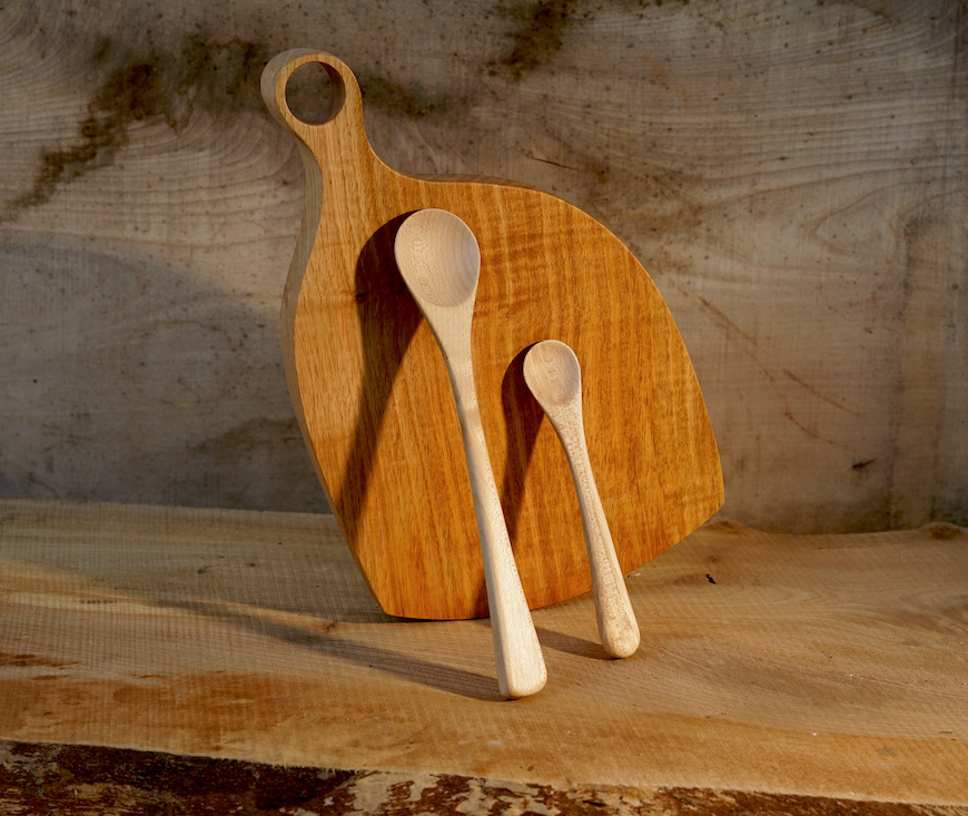 Sycamore spoons resting on a sweet chestnut board.