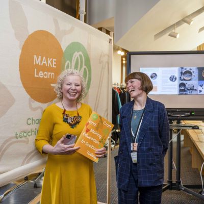 women laughing at event